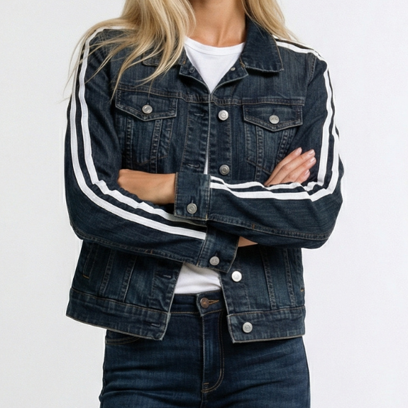 Woman wearing a dark denim jacket with white stripes on a white background