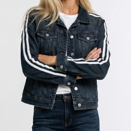 Woman wearing a dark denim jacket with white stripes on a white background