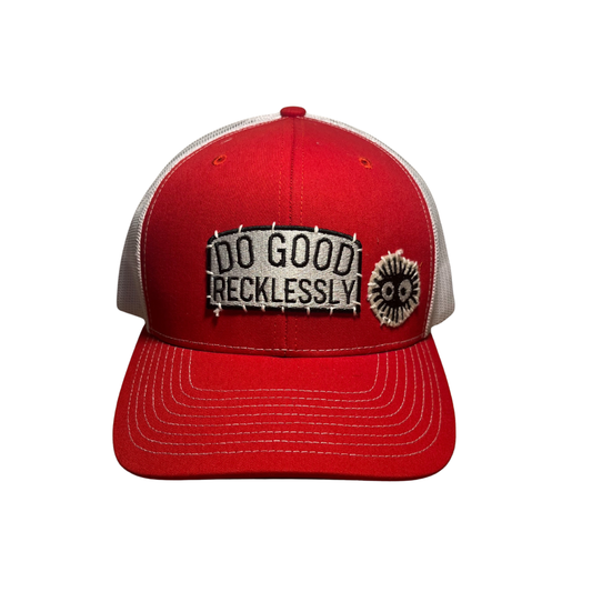 Red cap with 'Do Good Recklessly' patch on a white background
