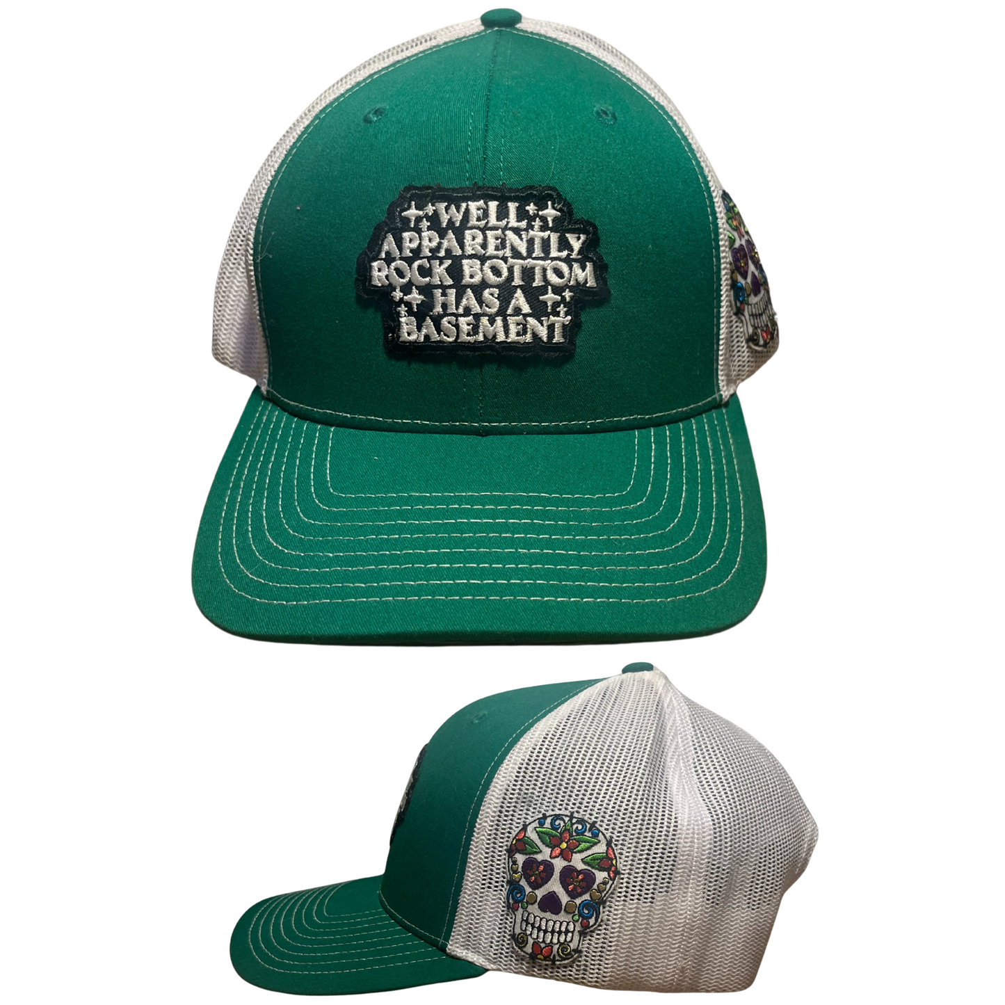 Green and white cap with text and skull design on a white background
